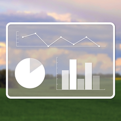Im Vordergrund sind verschiedene Diagramme zu sehen, im Hintergrund ein Feld.
