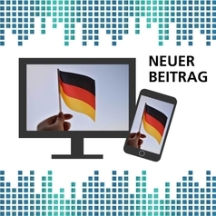 35 Jahre Deutsche Einheit: Auf einem Smartphone und einem Bildschirm ist eine Hand zu sehen, die eine kleine Deutschlandflagge schwenkt.