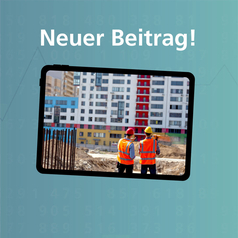 Auf dem Bildschirm sind zwei Männer auf einer Baustelle zu sehen.